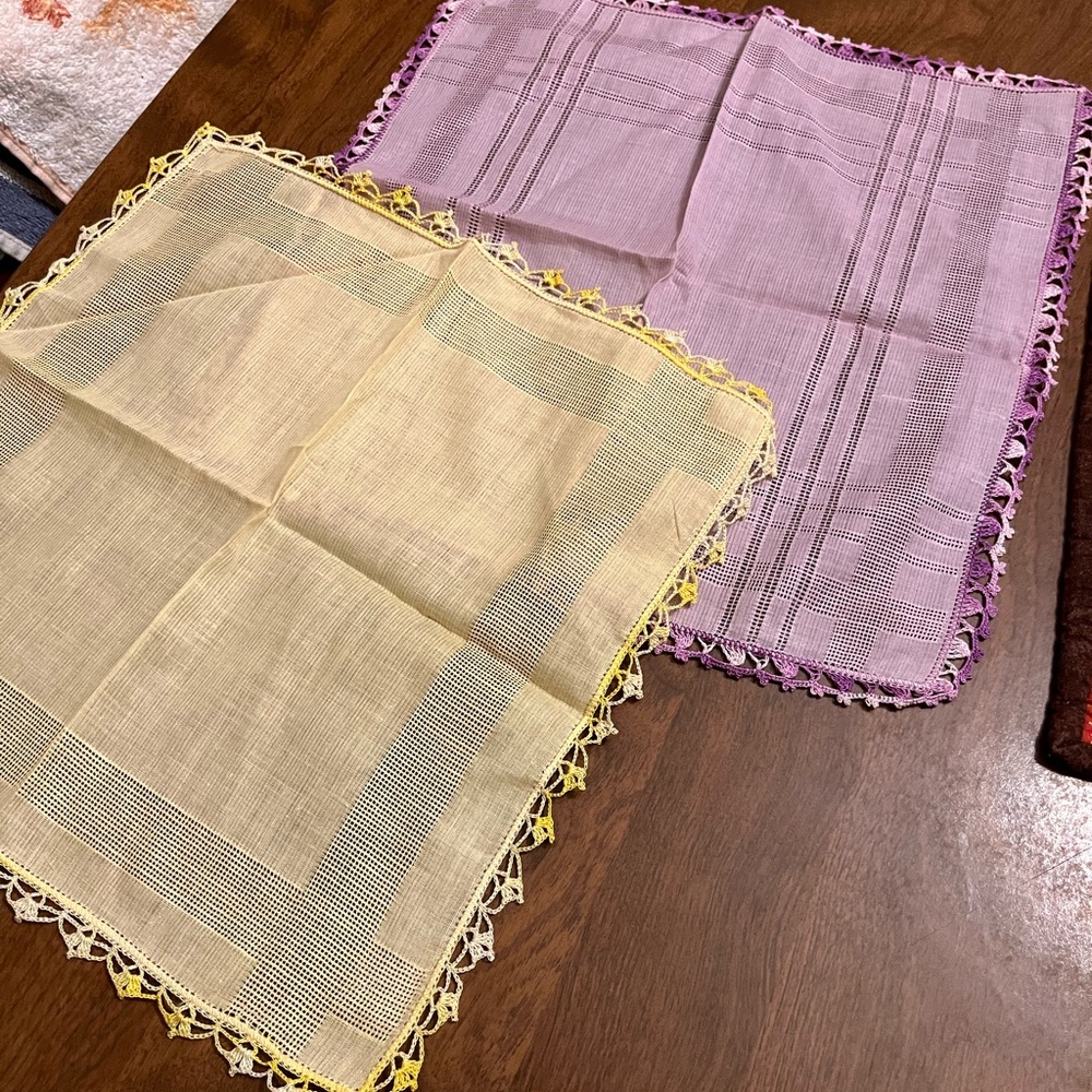Two doilies yellow and purple